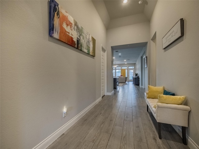 corridor featuring wood-type flooring