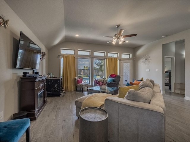 living room featuring light wood-type flooring and ceiling fan