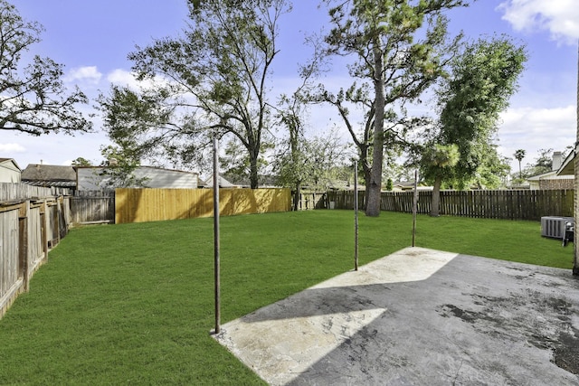 view of yard featuring central AC and a patio area