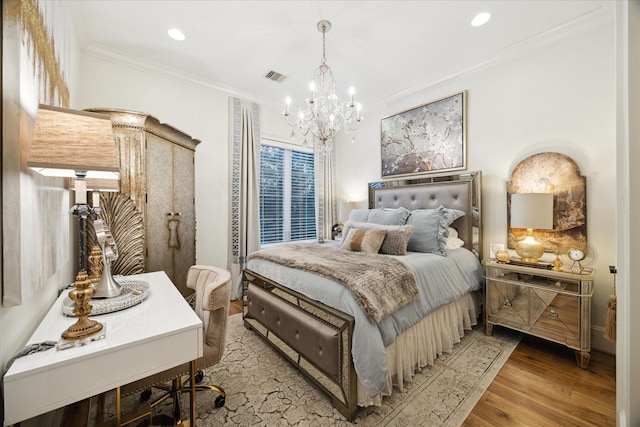 bedroom with light wood-type flooring, crown molding, and an inviting chandelier