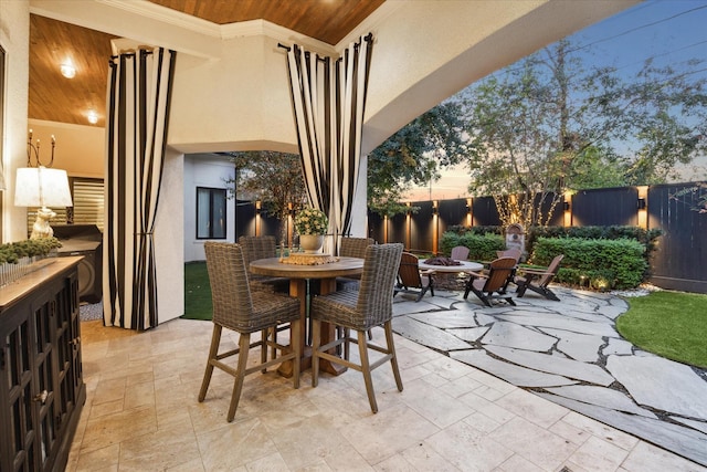 patio terrace at dusk with a fire pit