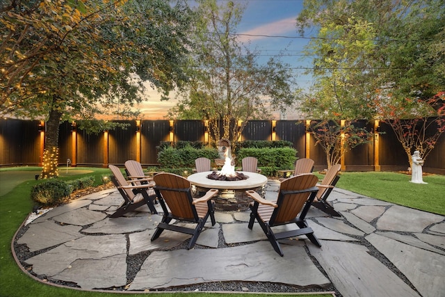 patio terrace at dusk with a fire pit