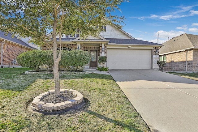 view of front of property with a front yard and a garage