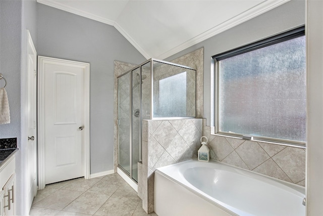 bathroom with tile patterned flooring, vanity, lofted ceiling, and independent shower and bath