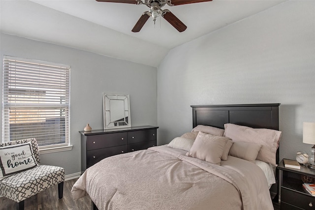 bedroom with ceiling fan, wood-type flooring, and lofted ceiling