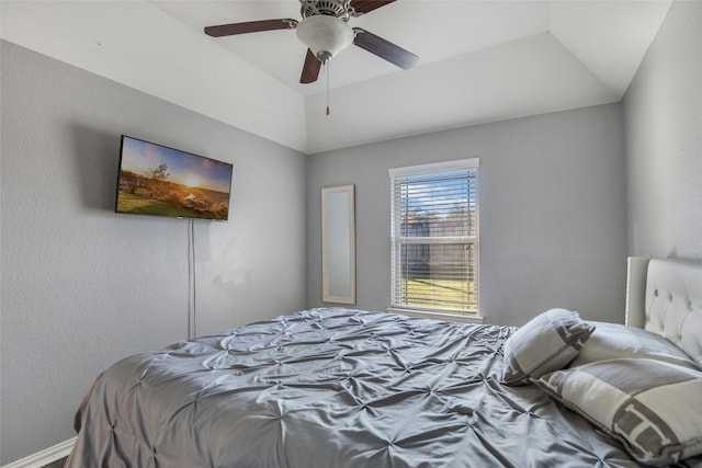 bedroom featuring ceiling fan and vaulted ceiling