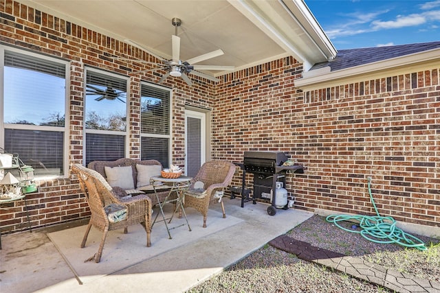 view of patio featuring area for grilling, ceiling fan, and an outdoor hangout area