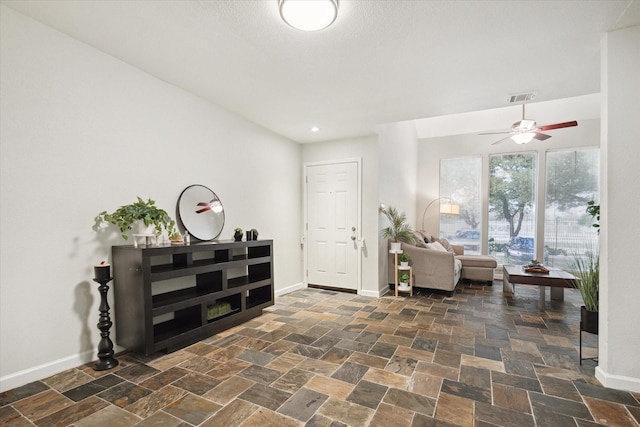 entryway featuring ceiling fan