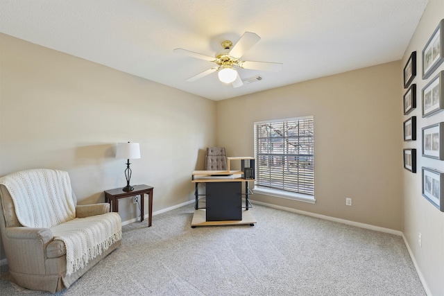 home office with ceiling fan and carpet floors