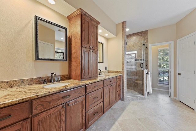 bathroom featuring vanity and an enclosed shower