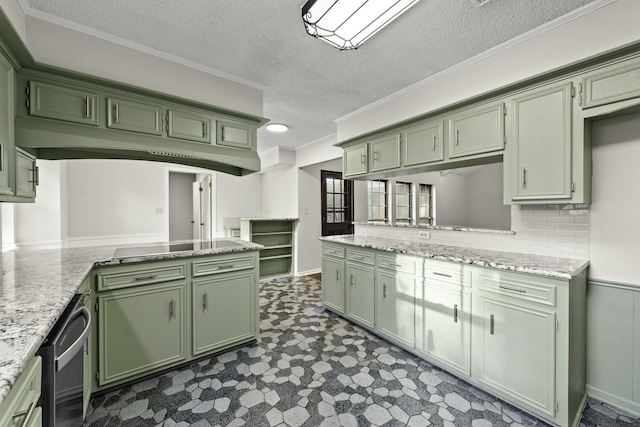 kitchen featuring light stone countertops, a textured ceiling, and green cabinetry