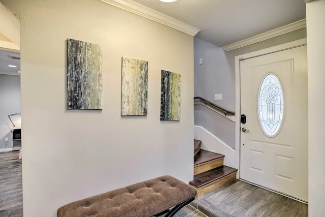 entryway featuring hardwood / wood-style floors and crown molding