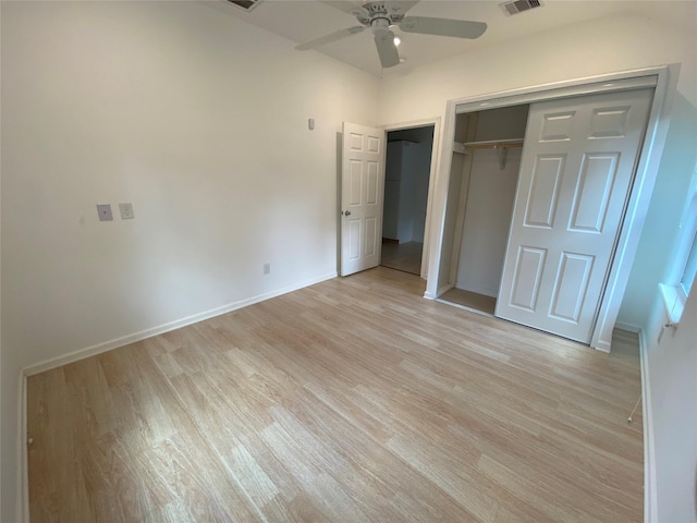 unfurnished bedroom with ceiling fan, a closet, and light hardwood / wood-style floors