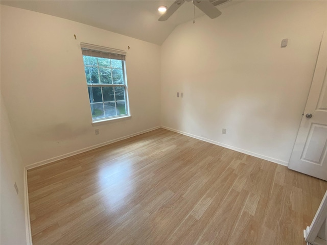 unfurnished room with light hardwood / wood-style floors, ceiling fan, and lofted ceiling