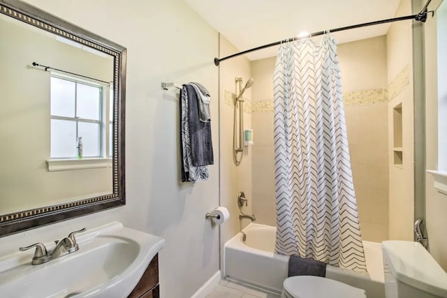 full bathroom featuring toilet, vanity, and shower / tub combo with curtain