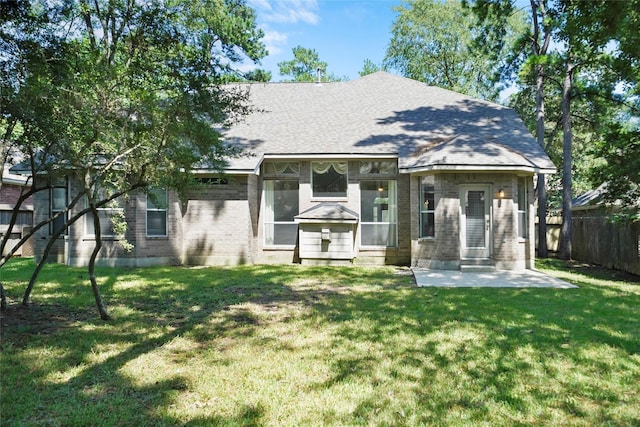 view of front of property with a patio and a front lawn