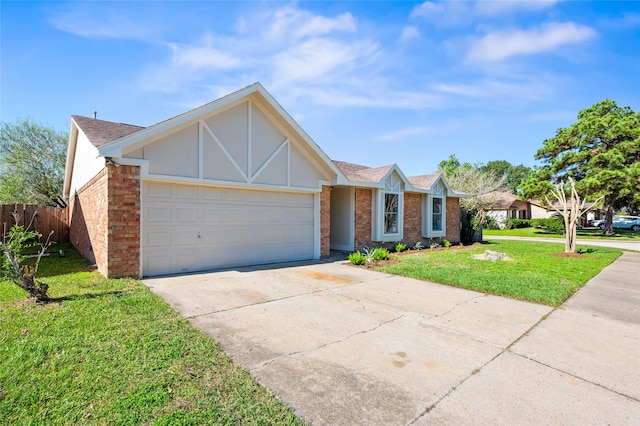 view of front of property with a front yard and a garage