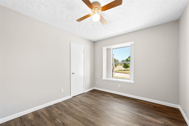 unfurnished room with a textured ceiling, ceiling fan, and dark hardwood / wood-style floors