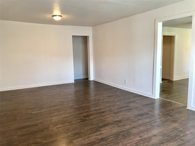 unfurnished room featuring dark hardwood / wood-style floors