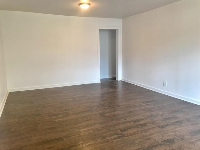 empty room featuring dark hardwood / wood-style floors