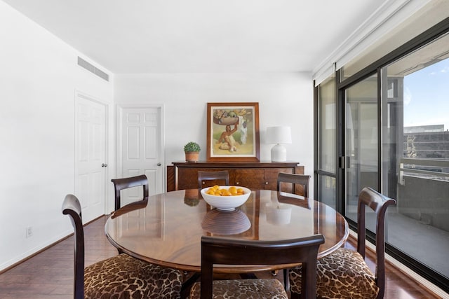 dining space featuring dark wood-type flooring