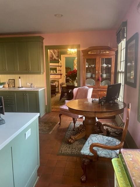 tiled dining room featuring sink