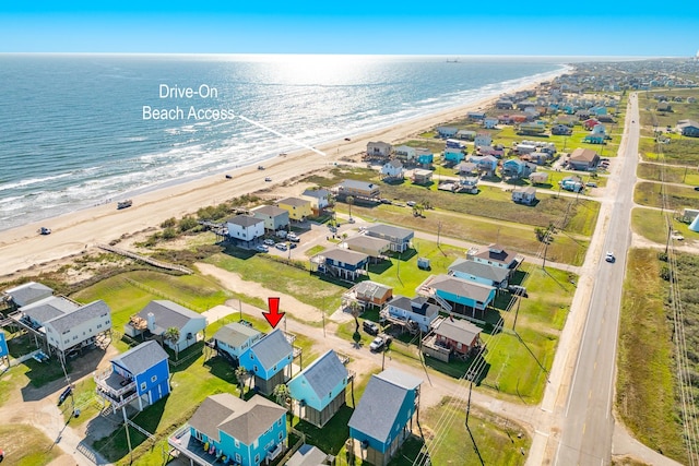 aerial view featuring a water view and a beach view