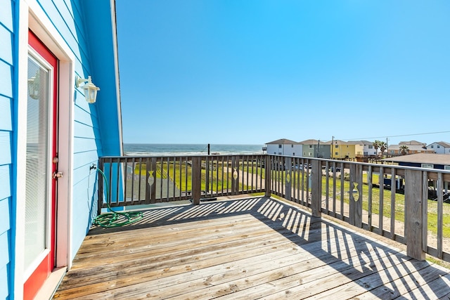 wooden deck with a water view