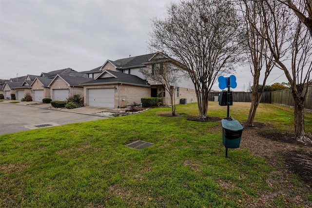 view of front of home with a garage and a front yard