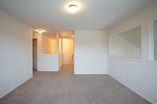 spare room with light carpet