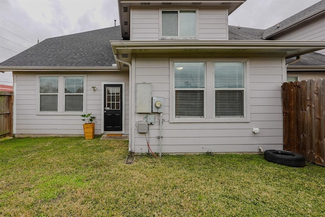 rear view of house with a yard