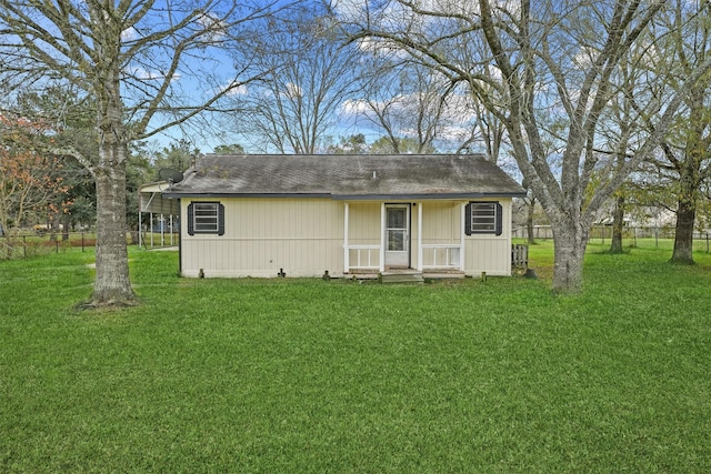 back of house with a yard