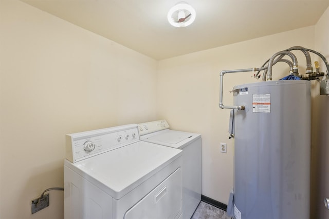 laundry area with gas water heater and independent washer and dryer