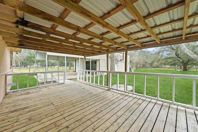 wooden terrace featuring a lawn