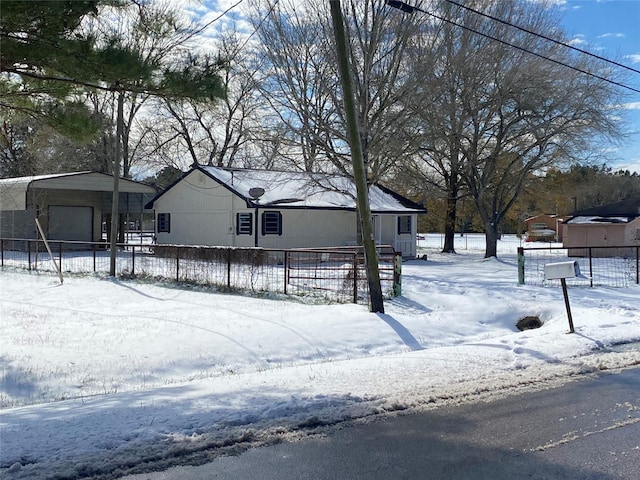 view of front of property featuring a carport