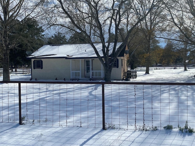 view of snow covered house