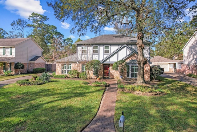 tudor home with a front yard