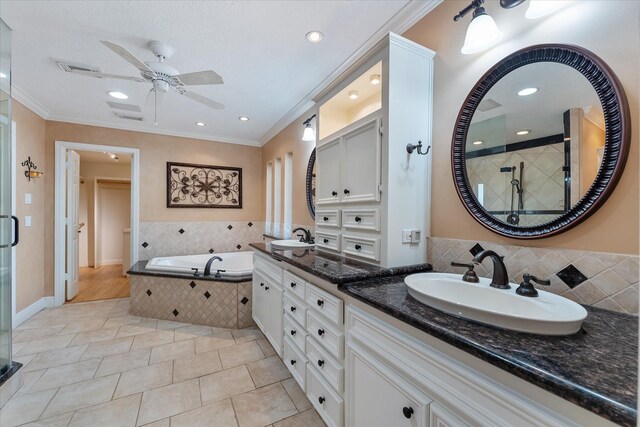 bathroom with crown molding, vanity, independent shower and bath, and tile patterned flooring