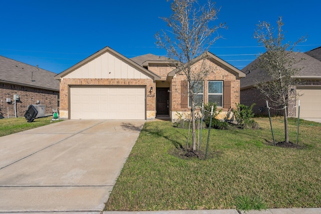 ranch-style house featuring a garage and a front yard