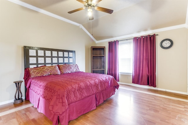 bedroom featuring crown molding, light hardwood / wood-style flooring, ceiling fan, and lofted ceiling