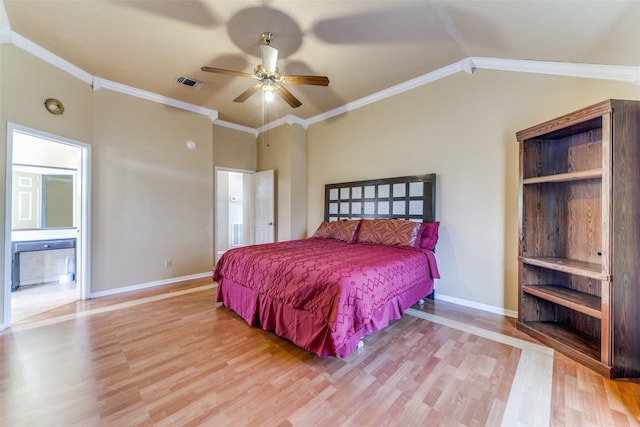 bedroom featuring lofted ceiling, ensuite bathroom, ceiling fan, ornamental molding, and light hardwood / wood-style floors