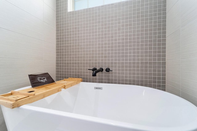 bathroom featuring a washtub