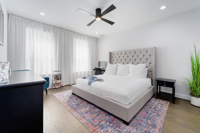 bedroom with hardwood / wood-style floors and ceiling fan