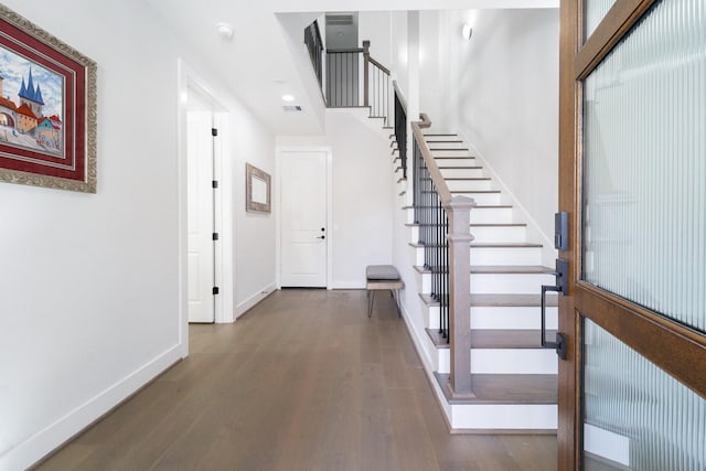 foyer entrance featuring dark hardwood / wood-style flooring