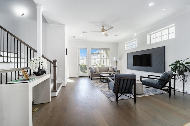 living room featuring crown molding, dark hardwood / wood-style flooring, and ceiling fan