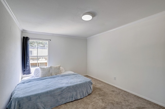 bedroom with crown molding and carpet