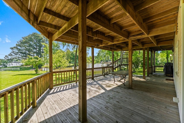 wooden deck with a yard