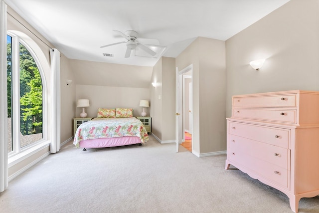 carpeted bedroom with ceiling fan and lofted ceiling