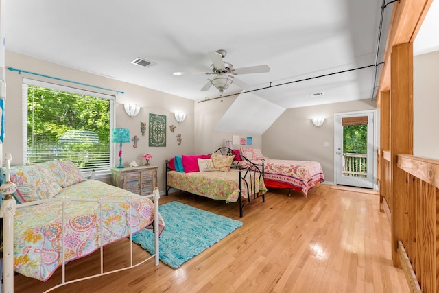 bedroom featuring ceiling fan, light hardwood / wood-style floors, and access to outside