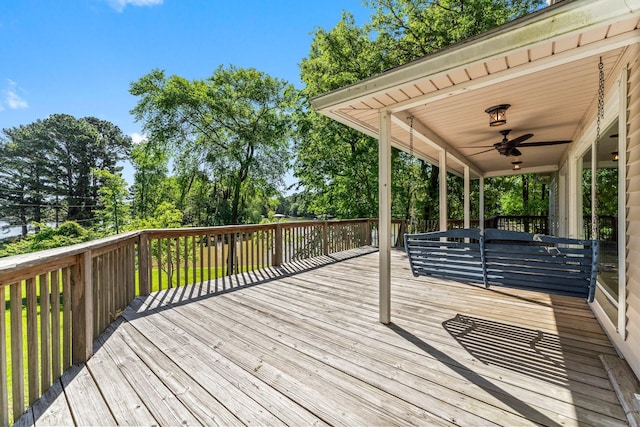 wooden terrace featuring ceiling fan